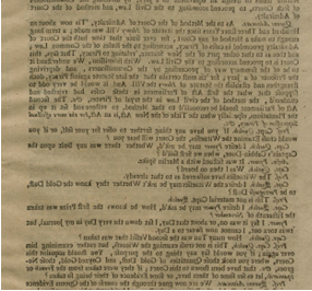 Color photograph of black ink printed text on paper discolored with age.